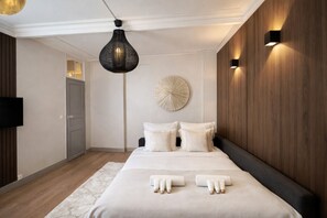 Superior Apartment, City View | Living area | 80-cm Smart TV with digital channels - TOCQUEVILLE (Paris)