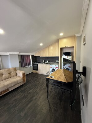 Deluxe Suite, Balcony, Sea View | Living area | 53-inch LCD TV with satellite channels