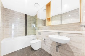 Shower, hair dryer, towels, toilet paper