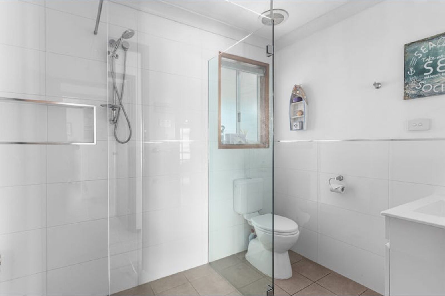 Shower, hair dryer, soap, toilet paper