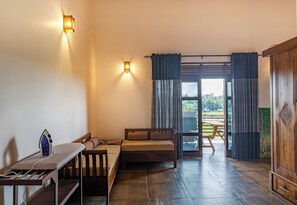 Deluxe Double Room | Living area | Flat-screen TV
