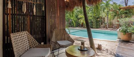 Deluxe Bungalow, Garden View, Poolside | Terrace/patio