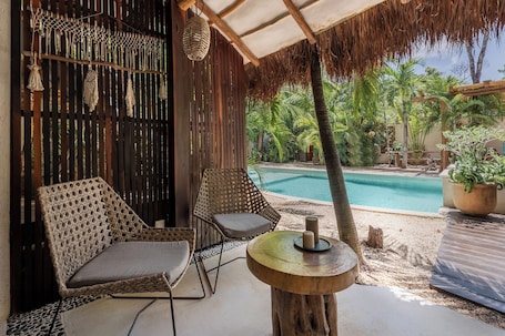 Deluxe Bungalow, Garden View, Poolside | Terrace/patio