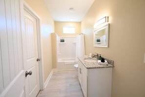 Shower, hair dryer, towels, shampoo