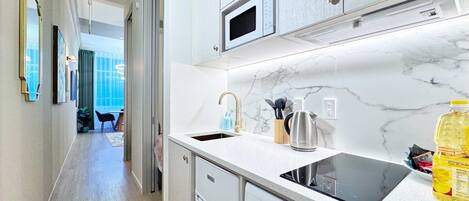 Fridge, microwave, stovetop, coffee/tea maker