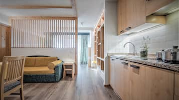 Superior Studio, Balcony, Mountain View | Living area | Flat-screen TV