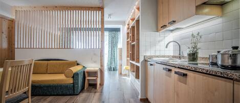 Superior Studio, Balcony, Mountain View | Living area | Flat-screen TV