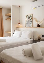 Triple Room | In-room safe, desk, laptop workspace, blackout drapes