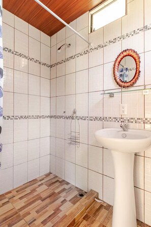 Shower, towels, soap, toilet paper