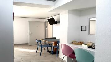 Family Triple Room, 1 Bedroom, Courtyard View | In-room dining