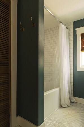 Shower, hair dryer, towels, toilet paper