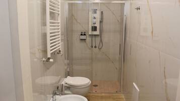 Deluxe Room, Balcony, City View | Bathroom | Shower, hair dryer, bathrobes, slippers