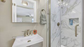 Shower, hair dryer, towels, soap
