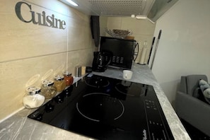 Fridge, microwave, stovetop, coffee/tea maker