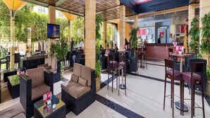 A spacious indoor area with seating arrangements, a reception desk, and a television screen. - Concorde El Salam Cairo Hotel & Casino (Cairo)