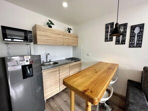 Fridge, microwave, stovetop, coffee/tea maker