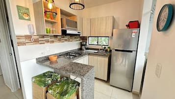 Fridge, microwave, stovetop, coffee/tea maker