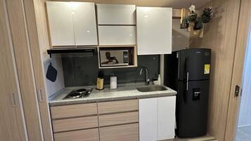 Fridge, microwave, stovetop, coffee/tea maker