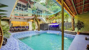 Outdoor pool, open 1:00 PM to 9:30 PM, pool umbrellas, pool loungers