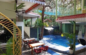 Outdoor pool, open 1:00 PM to 9:30 PM, pool umbrellas, sun loungers