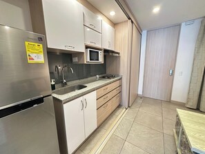 Microwave, coffee/tea maker, cookware/dishes/utensils