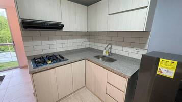 Fridge, stovetop, coffee/tea maker, cookware/dishes/utensils