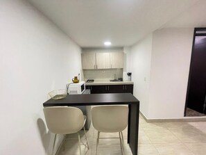 Microwave, coffee/tea maker, cookware/dishes/utensils