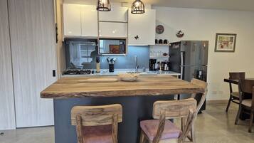 Fridge, microwave, stovetop, coffee/tea maker