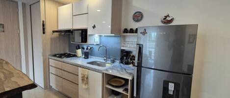 Fridge, microwave, stovetop, coffee/tea maker