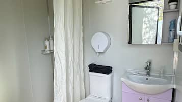 Shower, towels, soap, toilet paper