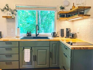 Fridge, microwave, stovetop, coffee/tea maker