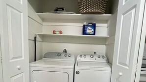 A laundry room with two stacked washing machines and a dryer. - Miami Art Deco Vibes • Stay Near Downtown (Tampa)