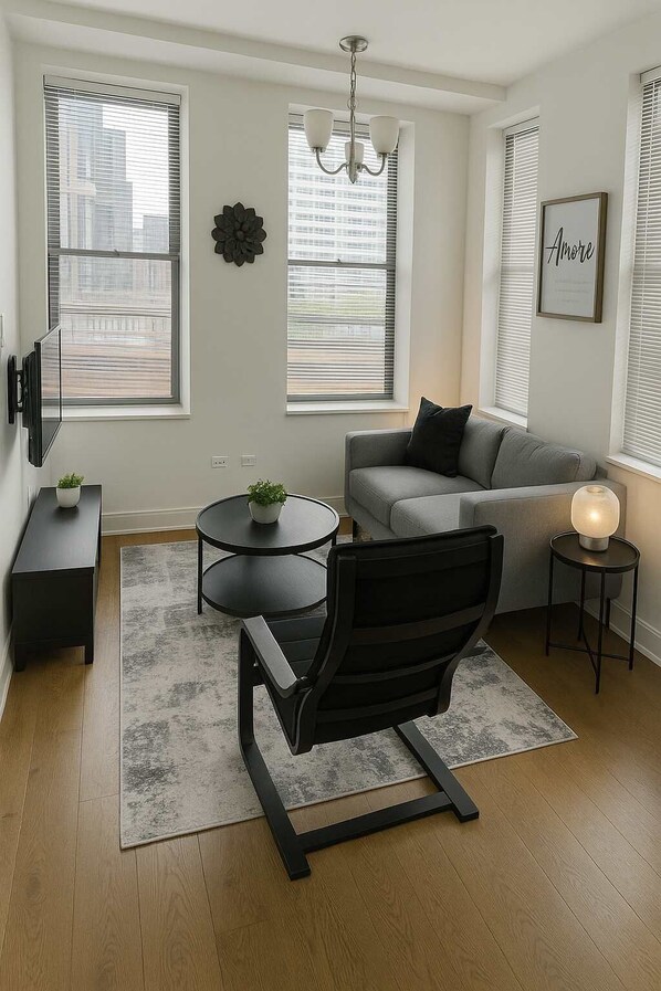 TV, offices - Sun-Drenched 1BR Apartment (Chicago)