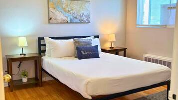 1 bedroom, desk, iron/ironing board, travel crib