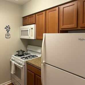 Fridge, microwave, stovetop, coffee/tea maker