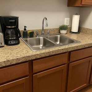 Fridge, microwave, stovetop, coffee/tea maker