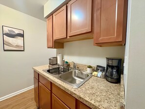 Fridge, microwave, stovetop, coffee/tea maker