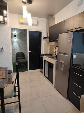 Microwave, electric kettle, toaster, cookware/dishes/utensils