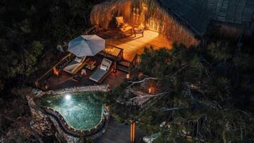Relax on a thatched-roof deck with outdoor seating and enjoy the tranquil surroundings.