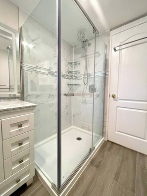 Shower, hair dryer, towels, soap