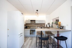 Fridge, microwave, coffee/tea maker, cookware/dishes/utensils