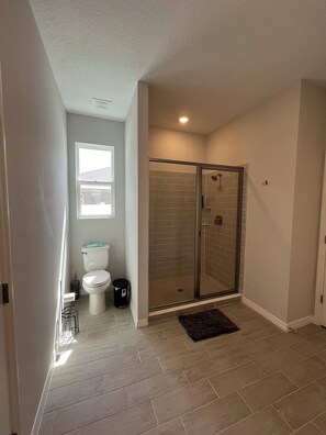 Shower, towels, soap, toilet paper