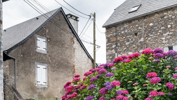 A stone building with a sloped roof and a window with shutters. - Holiday Home 'Chez Bob' with Mountain View and Wi-Fi (Hèches)