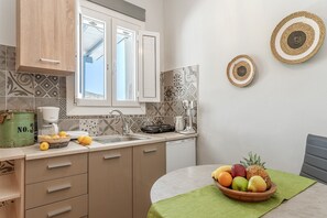 Fridge, stovetop, coffee/tea maker, cookware/dishes/utensils