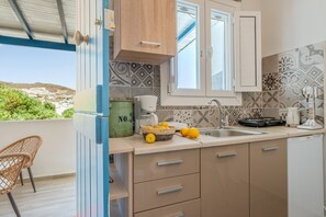 Fridge, stovetop, coffee/tea maker, cookware/dishes/utensils