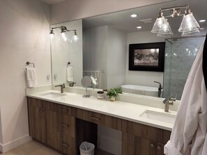 Shower, hair dryer, towels, toilet paper