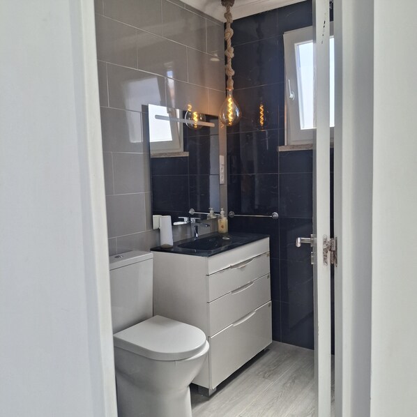 Shower, hair dryer, towels, soap