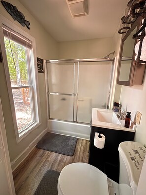 Shower, hair dryer, towels, toilet paper