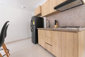Fridge, microwave, stovetop, coffee/tea maker