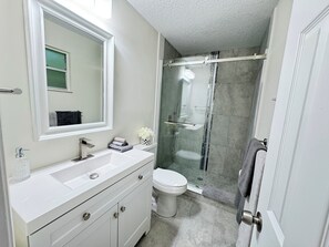 Shower, hair dryer, towels, soap